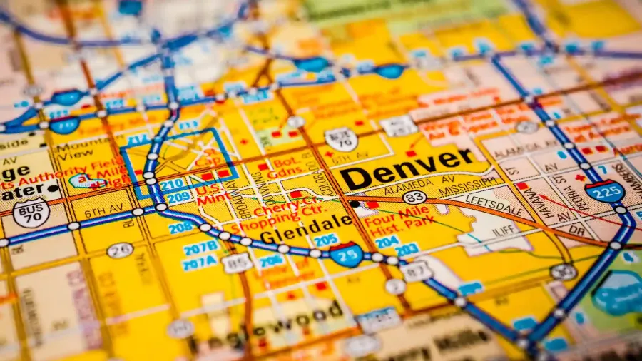 A close-up view of a Denver, Colorado street map highlighting the city center and surrounding neighborhoods, representing the urban sophistication and culturally rich communities drawing people to relocate to the Mile High City in 2025.