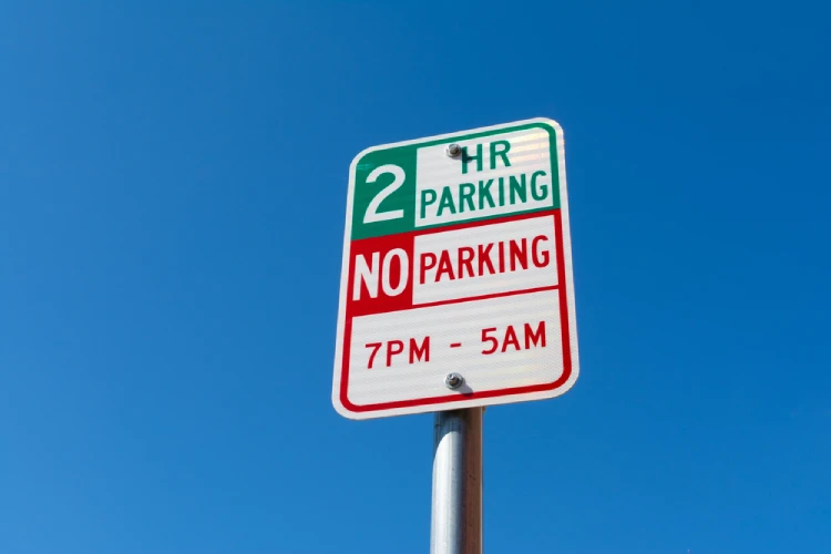 Denver-street-sign-showing-two-hour-parking-and-no-parking-restrictions-for-moving-trucks.